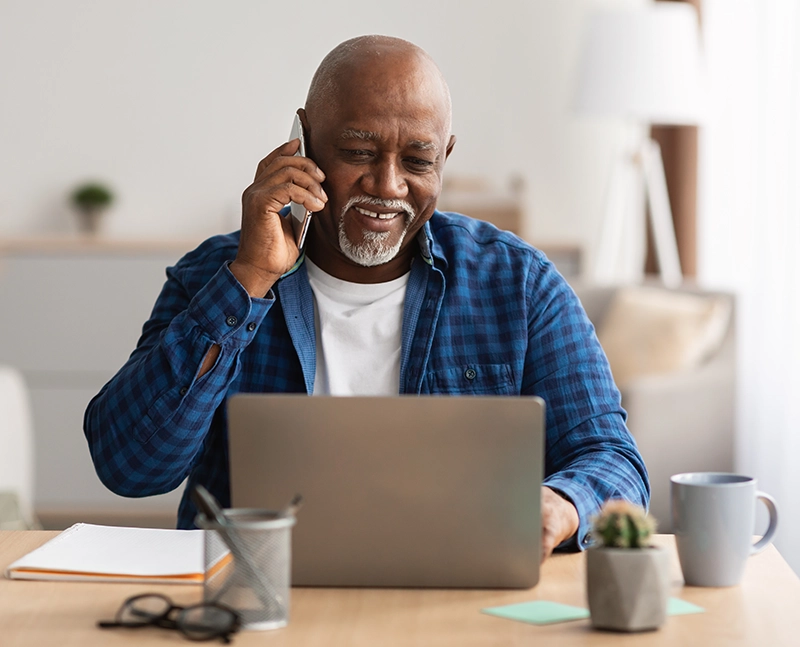 Man talking to doctor on laptop